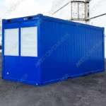 Ein blauer 20′ Bürocontainer mit zwei weißen Rollläden an der Vorderseite. Ideal für die Baustelle